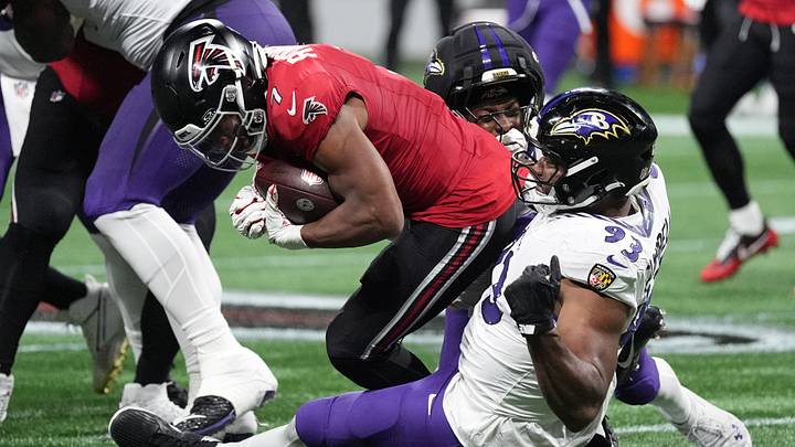 Baltimore Ravens defensive tackle Calais Campbell and Atlanta Falcons running back Bijan Robinson