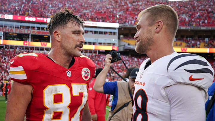Sep 15, 2024; Kansas City, Missouri, USA; Kansas City Chiefs tight end Travis Kelce (87) talks with Cincinnati Bengals tight end Mike Gesicki (88) after the game at GEHA Field at Arrowhead Stadium. Mandatory Credit: Denny Medley-Imagn Images