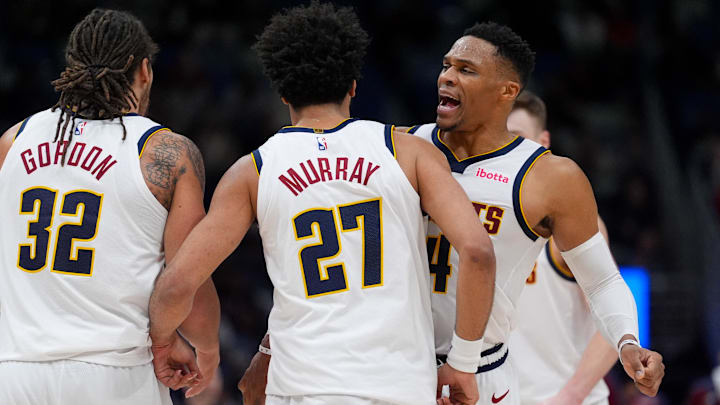 Dec 22, 2024; New Orleans, Louisiana, USA; Denver Nuggets guard Russell Westbrook (4) celebrates a basket by guard Jamal Murray (27) next to forward Aaron Gordon (32) against the New Orleans Pelicans during overtime at Smoothie King Center. Mandatory Credit: Matthew Hinton-Imagn Images