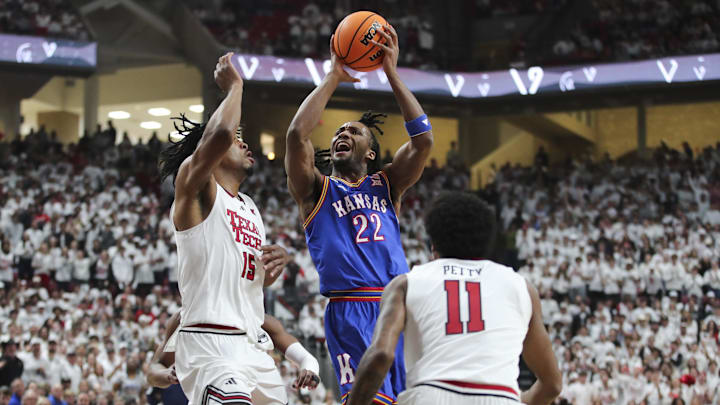 Feb 2, 2026; Lubbock, Texas, USA;  Kansas Jayhawks guard Darryn Peterson (22) goes to the basket against Texas Tech Red Raiders forward JT Toppin (15) in the first half at United Supermarkets Arena. Mandatory Credit: Michael C. Johnson-Imagn Images