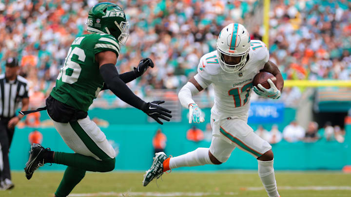 Miami Dolphins wide receiver Jaylen Waddle (17) runs with the football past New York Jets safety Chuck Clark (36) during the second quarter at Hard Rock Stadium. Miami Dolphins wide receiver Jaylen Waddle (17) runs with the football past New York Jets safety Chuck Clark (36) during the second quarter at Hard Rock Stadium.