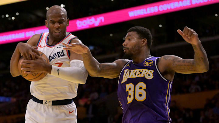Nov 25, 2025; Los Angeles, California, USA: Los Angeles Clippers guard Chris Paul (3) beats Los Angeles Lakers guard Marcus Smart (36) to a rebound during the first half at Crypto.com Arena. Mandatory Credit: Jayne Kamin-Oncea-Imagn Images