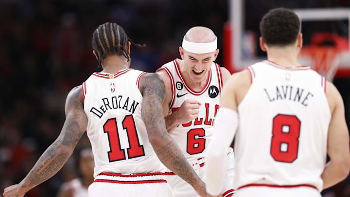 Chicago Bulls guard Alex Caruso (6) celebrates with forward DeMar DeRozan (11) after scoring against the Boston Celtics during the second half at United Center. Mandatory Credit: Kamil Krzaczynski-Imagn Images