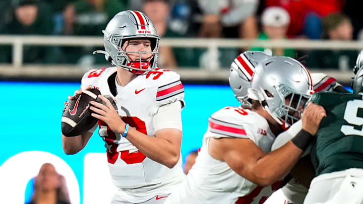 Sep 28, 2024; East Lansing, Michigan, USA; Ohio State Buckeyes quarterback Devin Brown (33) looks to pass the ball in the second half at Spartan Stadium on Saturday.