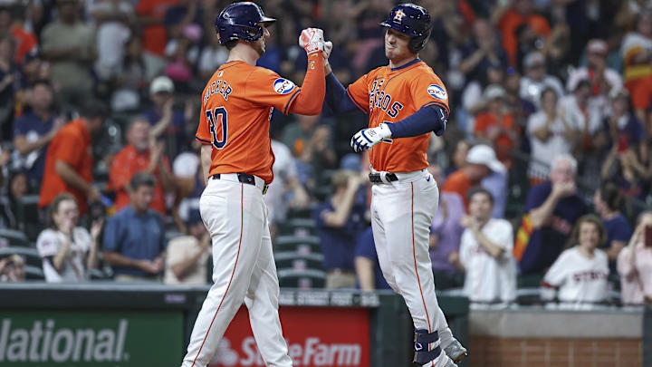 Sep 20, 2024; Houston, Texas, USA; Houston Astros third baseman Alex Bregman (2) celebrates with right fielder Kyle Tucker (30) after hitting a home run during the third inning at Minute Maid Park. Mandatory Credit: Troy Taormina-Imagn Images