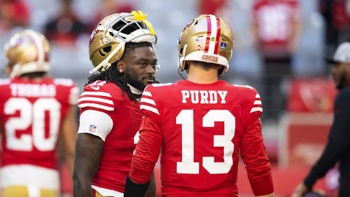 Dec 17, 2023; Glendale, Arizona, USA; San Francisco 49ers quarterback Brock Purdy (13) with wide receiver Brandon Aiyuk (11) against the Arizona Cardinals at State Farm Stadium. Mandatory Credit: Mark J. Rebilas-USA TODAY Sports