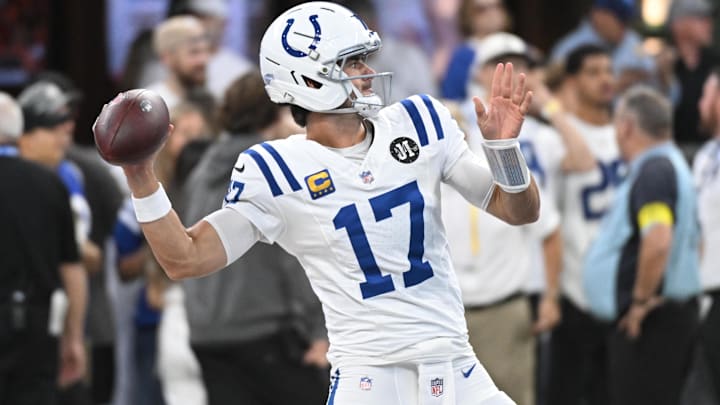 Sep 14, 2025; Indianapolis, Indiana, USA; Indianapolis Colts quarterback Daniel Jones (17) warms up prior to the game against the Denver Broncos at Lucas Oil Stadium. Mandatory Credit: Robert Goddin-Imagn Images
