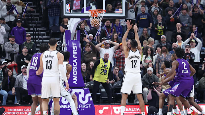 Jan 12, 2025; Salt Lake City, Utah, USA; Brooklyn Nets forward Tosan Evbuomwan (12) makes a free throw against the Utah Jazz to take the lead with 6.4 seconds left during overtime at Delta Center. Mandatory Credit: Rob Gray-Imagn Images Jan 12, 2025; Salt Lake City, Utah, USA; Brooklyn Nets forward Tosan Evbuomwan (12) makes a free throw against the Utah Jazz to take the lead with 6.4 seconds left during overtime at Delta Center. Mandatory Credit: Rob Gray-Imagn Images