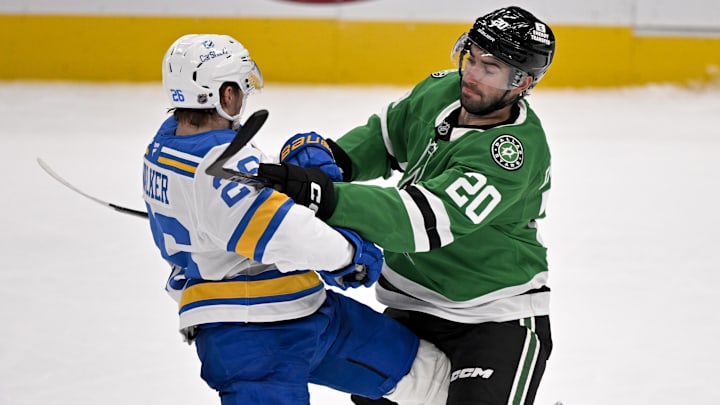 Feb 4, 2026; Dallas, Texas, USA; Dallas Stars defenseman Kyle Capobianco (20) checks St. Louis Blues left wing Nathan Walker (26) during the third period at the American Airlines Center. Mandatory Credit: Jerome Miron-Imagn Images