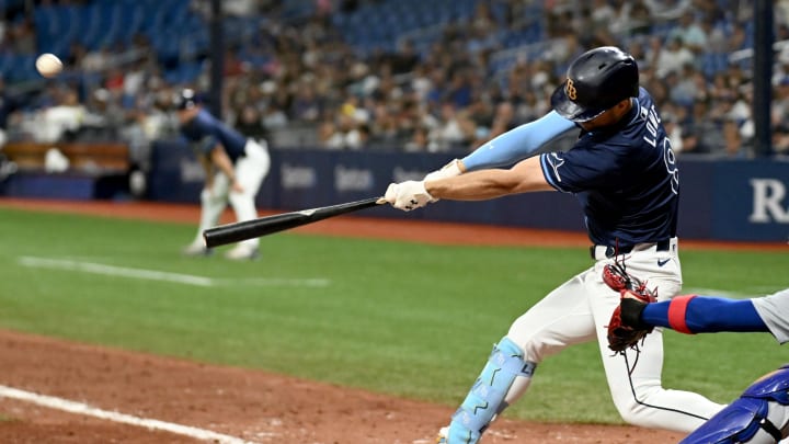 Jun 11, 2024; St. Petersburg, Florida, USA; Tampa Bay Rays designated hitter Brandon Lowe (8) hits a three run game winning home run in the ninth inning against the Chicago Cubs at Tropicana Field.