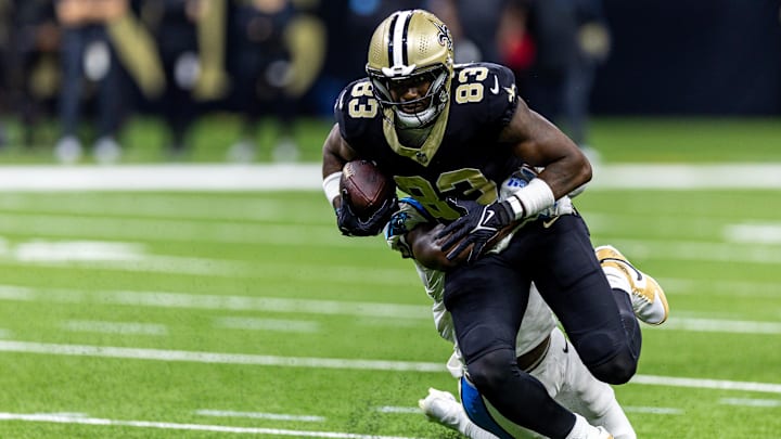 New Orleans Saints tight end Juwan Johnson (83) is tackled after a catch against the Carolina Panthers