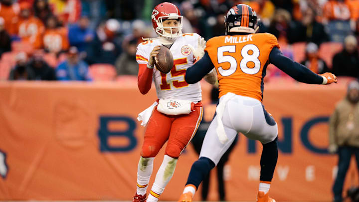 Dec 31, 2017; Denver, CO, USA; Kansas City Chiefs quarterback Patrick Mahomes (15) looks to pass under pressure from Denver Broncos linebacker Von Miller (58) in the third quarter at Sports Authority Field at Mile High. Mandatory Credit: Isaiah J. Downing-Imagn Images
