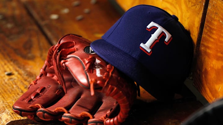 Apr 6, 2014; St. Petersburg, FL, USA; Texas Rangers hat and glove lay in the dugout against the Tampa Bay Rays at Tropicana Field. Texas Rangers defeated the Tampa Bay Rays 3-0.