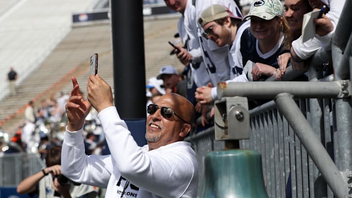 Penn State football coach James Franklin takes a selfie with students following the Blue-White Game at Beaver Stadium. 