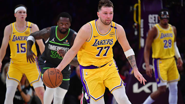 Apr 30, 2025; Los Angeles, California, USA; Los Angeles Lakers guard Luka Doncic (77) moves the ball up court against the Minnesota Timberwolves during the first half in game five of first round for the 2025 NBA Playoffs at Crypto.com Arena. Mandatory Credit: Gary A. Vasquez-Imagn Images Apr 30, 2025; Los Angeles, California, USA; Los Angeles Lakers guard Luka Doncic (77) moves the ball up court against the Minnesota Timberwolves during the first half in game five of first round for the 2025 NBA Playoffs at Crypto.com Arena. Mandatory Credit: Gary A. Vasquez-Imagn Images