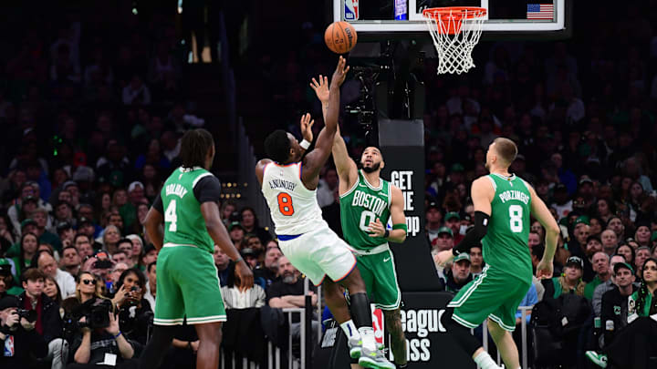 Feb 23, 2025; Boston, Massachusetts, USA;  New York Knicks forward OG Anunoby (8) shoots the ball over Boston Celtics forward Jayson Tatum (0) during the second half at TD Garden. Mandatory Credit: Bob DeChiara-Imagn Images