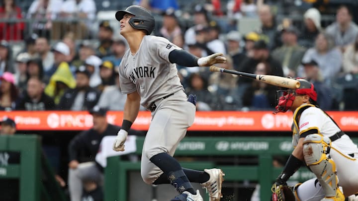Apr 5, 2025; Pittsburgh, Pennsylvania, USA;  New York Yankees shortstop Anthony Volpe (11) hits a three run double against the Pittsburgh Pirates during the fifth inning  at PNC Park. 