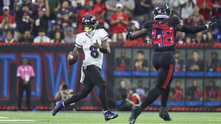 Dec 15, 2024; Houston, Texas, USA; Baltimore Ravens quarterback Lamar Jackson (8) scrambles with the ball during the second quarter against the Houston Texans at NRG Stadium. Mandatory Credit: Troy Taormina-Imagn Images