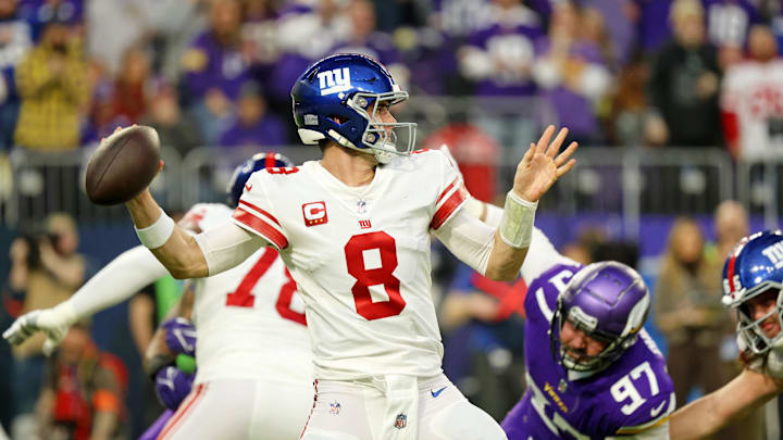Jan 15, 2023; Minneapolis, Minnesota, USA; New York Giants quarterback Daniel Jones (8) passes the ball against the Minnesota Vikings during the first quarter of a wild card game at U.S. Bank Stadium. Mandatory Credit: Matt Krohn-Imagn Images