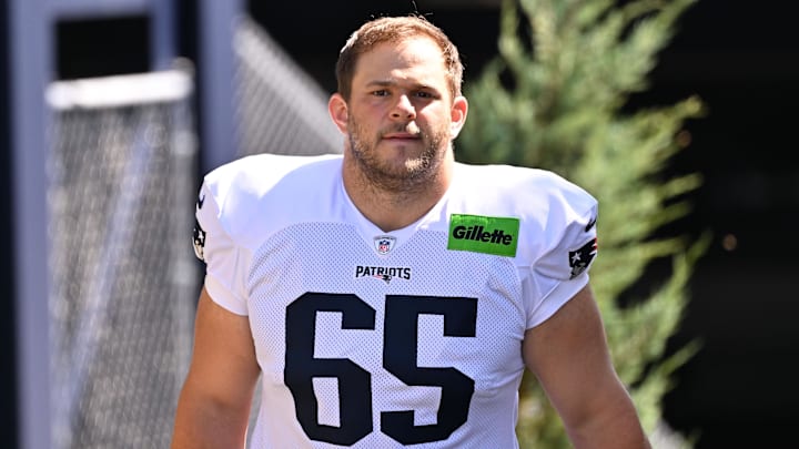 Jul 28, 2025; Foxborough, MA, USA; New England Patriots center Garrett Bradbury (65) heads to the practice fields for training camp at Gillette Stadium. Mandatory Credit: Eric Canha-Imagn Images