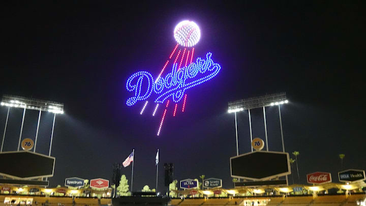 Mar 28, 2025; Los Angeles, California, USA; A Los Angeles Dodgers logo is projected during a drone show at Dodger Stadium. Mandatory Credit: Kirby Lee-Imagn Images