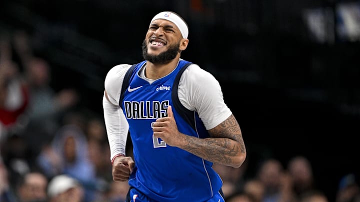 Mar 31, 2025; Dallas, Texas, USA; Dallas Mavericks center Daniel Gafford (21) grimaces as he runs back up the court during the second half against the Brooklyn Nets at the American Airlines Center. 