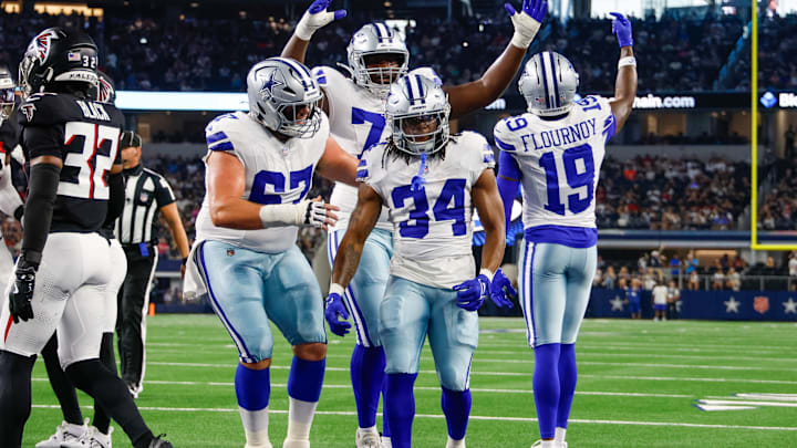 Aug 22, 2025; Arlington, Texas, USA; Teammates celebrate with Dallas Cowboys running back Jaydon Blue (34) after he scores a touchdown against the Atlanta Falcons during the first quarter at AT&T Stadium.