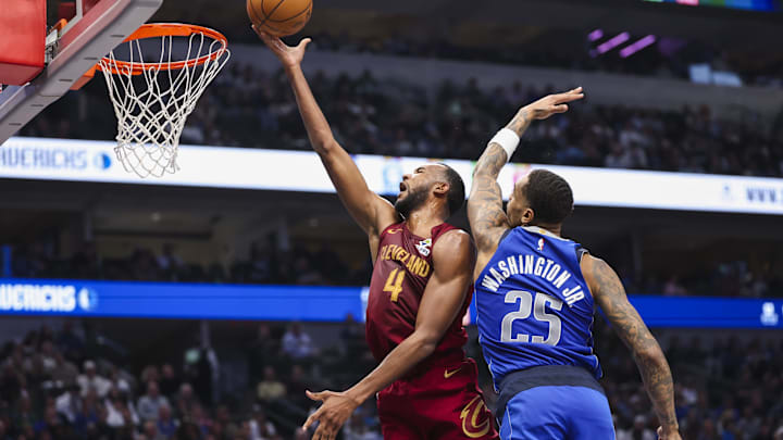 Jan 3, 2025; Dallas, Texas, USA;  Cleveland Cavaliers forward Evan Mobley (4) shoots past Dallas Mavericks forward P.J. Washington (25) during the first half at American Airlines Center. Mandatory Credit: Kevin Jairaj-Imagn Images