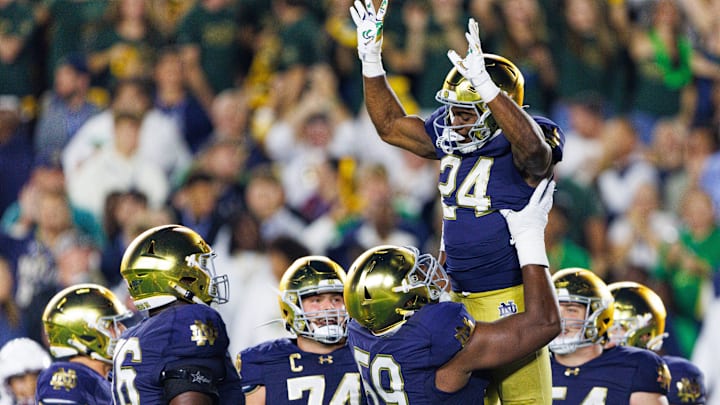 Notre Dame offensive lineman Aamil Wagner (59) lifts up running back Jadarian Price (24) after a Price touchdown in the second half of a NCAA football game against Texas A&M at Notre Dame Stadium on Saturday, Sept. 13, 2025, in South Bend. Notre Dame offensive lineman Aamil Wagner (59) lifts up running back Jadarian Price (24) after a Price touchdown in the second half of a NCAA football game against Texas A&M at Notre Dame Stadium on Saturday, Sept. 13, 2025, in South Bend.