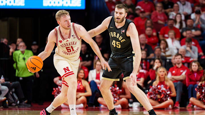 Nebraska forward Rienk Mast looks to pass against Purdue center Oscar Cluff during the second half at Pinnacle Bank Arena. 