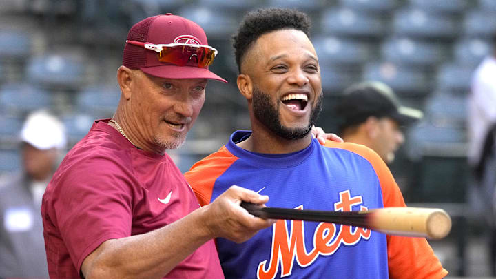 Apr 22, 2022; Phoenix, Arizona, USA; Arizona Diamondbacks bench coach Jeff Banister (82) talks to New York Mets second baseman Robinson Cano (24) before a game at Chase Field. 