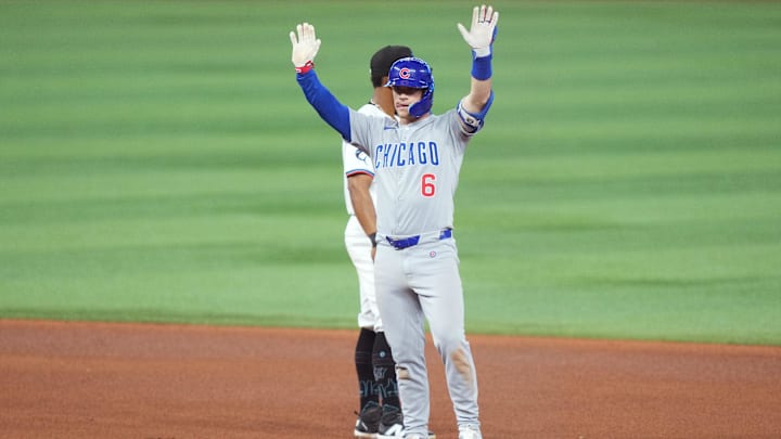 Chicago Cubs infielder Matt Shaw raises his hands after a hit. 