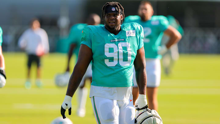 Miami Dolphins defensive tackle Kenneth Grant (90) looks on from the field during training camp at Baptist Health Training Complex. Miami Dolphins defensive tackle Kenneth Grant (90) looks on from the field during training camp at Baptist Health Training Complex.