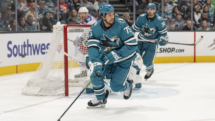 Jan 23, 2026; San Jose, California, USA;  San Jose Sharks right wing Ryan Reaves (75) controls the puck during the third period against the New York Rangers at SAP Center at San Jose. Mandatory Credit: Stan Szeto-Imagn Images
