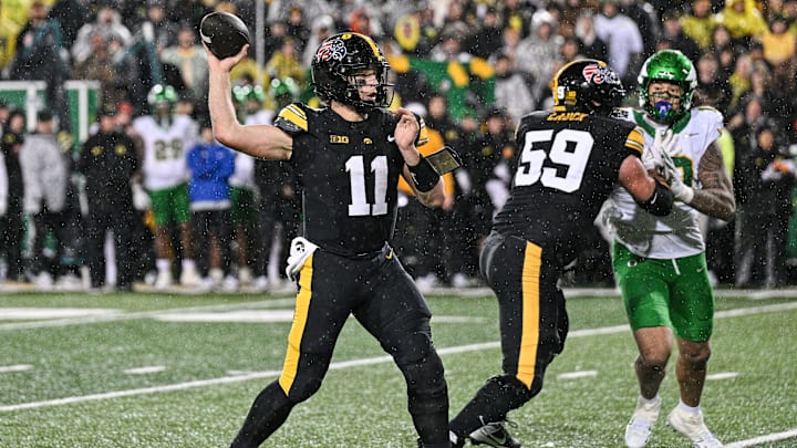 Nov 8, 2025; Iowa City, Iowa, USA; Iowa Hawkeyes quarterback Mark Gronowski (11) throws a pass during the fourth quarter against the Oregon Ducks at Kinnick Stadium. Mandatory Credit: Jeffrey Becker-Imagn Images Nov 8, 2025; Iowa City, Iowa, USA; Iowa Hawkeyes quarterback Mark Gronowski (11) throws a pass during the fourth quarter against the Oregon Ducks at Kinnick Stadium. Mandatory Credit: Jeffrey Becker-Imagn Images