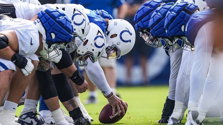 Indianapolis Colts players line up on the line of scrimmage on Monday, Aug. 3, 2026, during practice at Colts Camp at Grand Park in Westfield.