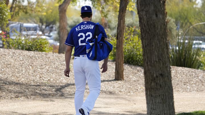 Feb 16, 2023; Glendale, AZ, USA; Los Angeles Dodgers starting pitcher Clayton Kershaw (22) walks to the practice fields during spring training camp. Mandatory Credit: Rick Scuteri-Imagn Images