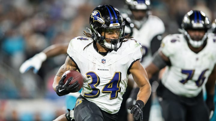 Dec 17, 2023; Jacksonville, Florida, USA; Baltimore Ravens running back Keaton Mitchell (34) runs the ball against the Jacksonville Jaguars in the fourth quarter at EverBank Stadium. Mandatory Credit: Jeremy Reper-USA TODAY Sports