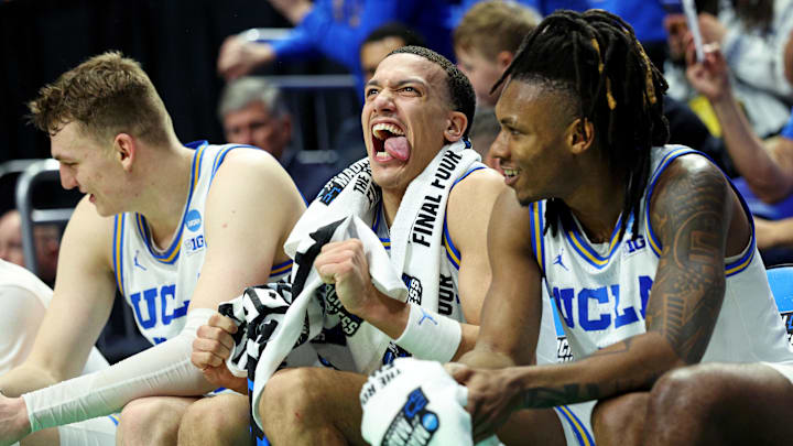 Mar 20, 2025; Lexington, KY, USA;  UCLA Bruins guard Kobe Johnson (0) reacts on the bench during the second half against the Utah State Aggies in the first round of the NCAA Tournament at Rupp Arena. Mandatory Credit: Jordan Prather-Imagn Images