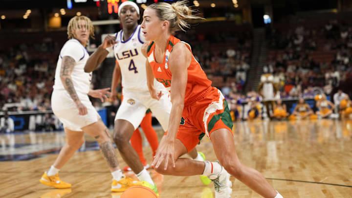 Miami Hurricanes guard Hanna Cavinder drives to the basket against LSU's Flau'jae Johnson in the NCAA women's tournament. 