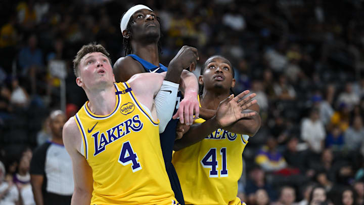 Oct 4, 2024; Palm Desert, California, USA; Los Angeles Lakers guard Dalton Knecht (4) and guard Quincy Olivari (41) watch a free throw against Minnesota Timberwolves forward Leonard Miller (33) during the second half at Acrisure Arena. Mandatory Credit: Jonathan Hui-Imagn Images