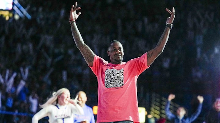 Oct 14, 2022; Lawrence, Kansas, US; Former NBA player Mario Chalmers celebrates after making a half-court shot to win a fan $10,000 during Late Night at the Phog at Allen Fieldhouse. Mandatory Credit: Jay Biggerstaff-Imagn Images