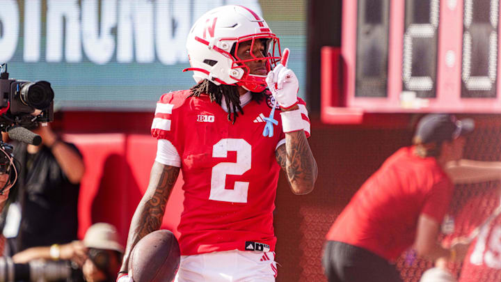 Sep 20, 2025; Lincoln, Nebraska, USA; Nebraska Cornhuskers wide receiver Jacory Barney Jr. (2) reacts after scoring a touchdown against the Michigan Wolverines during the second quarter at Memorial Stadium. Mandatory Credit: Dylan Widger-Imagn Images
