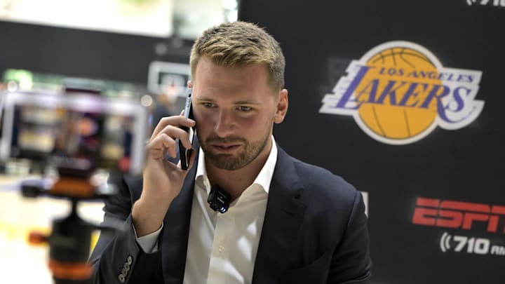 Aug 2, 2025; El Segundo, CA, USA; Los Angeles Lakers Luka Doncic (77) is interviewed by ESPN LA radio following a press conference announcing the signing of a 3-year, $165 million contract extension at UCLA Health Training Center. Mandatory Credit: Jayne Kamin-Oncea-Imagn Images Aug 2, 2025; El Segundo, CA, USA; Los Angeles Lakers Luka Doncic (77) is interviewed by ESPN LA radio following a press conference announcing the signing of a 3-year, $165 million contract extension at UCLA Health Training Center. Mandatory Credit: Jayne Kamin-Oncea-Imagn Images