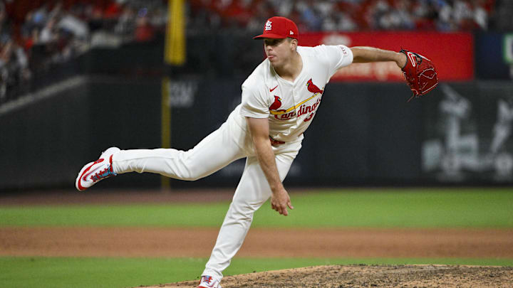 Jun 9, 2025; St. Louis, Missouri, USA;  St. Louis Cardinals relief pitcher Ryan Helsley (56) pitches against the Toronto Blue Jays during the ninth inning at Busch Stadium. Mandatory Credit: Jeff Curry-Imagn Images