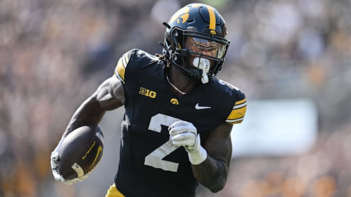 Oct 12, 2024; Iowa City, Iowa, USA; Iowa Hawkeyes running back Kaleb Johnson (2) runs for a 17-yard touchdown run during the second quarter against the Washington Huskies at Kinnick Stadium. 