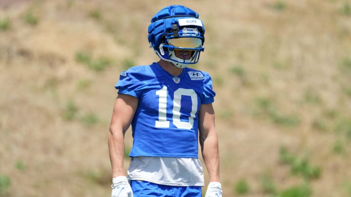 May 21, 2024, Thousand Oaks, California, USA; Los Angeles Rams wide receiver Cooper Kupp (10) wears a Guardian helmet cap during organized team activities at Cal Lutheran University. Mandatory Credit: Kirby Lee-USA TODAY Sports