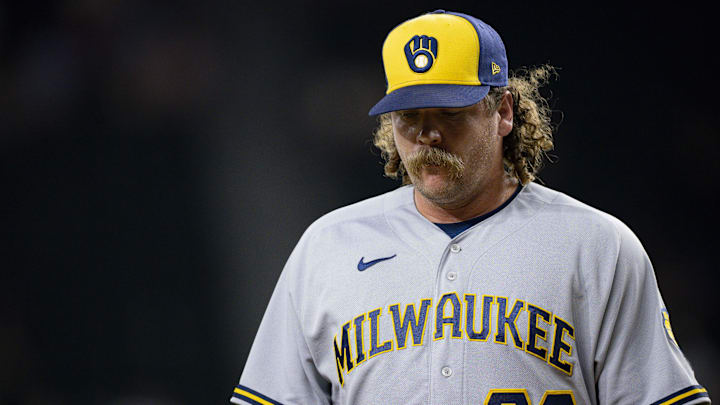Aug 18, 2023; Arlington, Texas, USA; Milwaukee Brewers relief pitcher Andrew Chafin (32) walks off the field after he pitches against the Texas Rangers during the ninth inning at Globe Life Field. Mandatory Credit: Jerome Miron-Imagn Images
