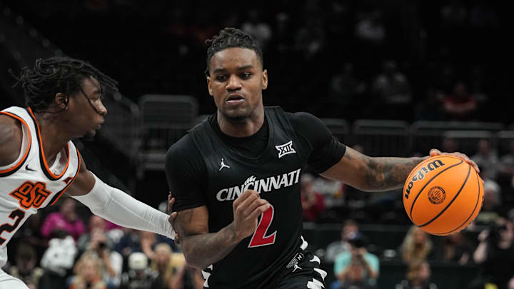 Bearcats Jizzle James (2) takes the ball down the court during Game 1 of the 2025 Phillips 66 Big 12 Basketball Championship against the Oklahoma State Cowboys at the T-Mobile Center in Kansas City, Missouri on Tuesday March 11, 2025. Bearcats lead the game at halftime with a score of 38-26.