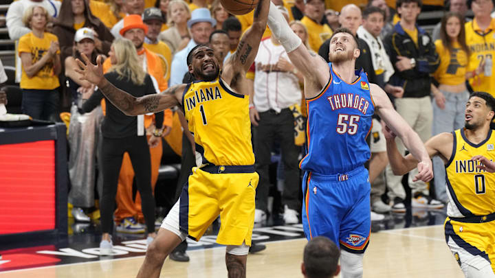 Jun 13, 2025; Indianapolis, Indiana, USA; Indiana Pacers forward Obi Toppin (1) and Oklahoma City Thunder center Isaiah Hartenstein (55) battle for control of the ball during the third quarter of game four of the 2025 NBA Finals at Gainbridge Fieldhouse. Mandatory Credit: Kyle Terada-Imagn Images